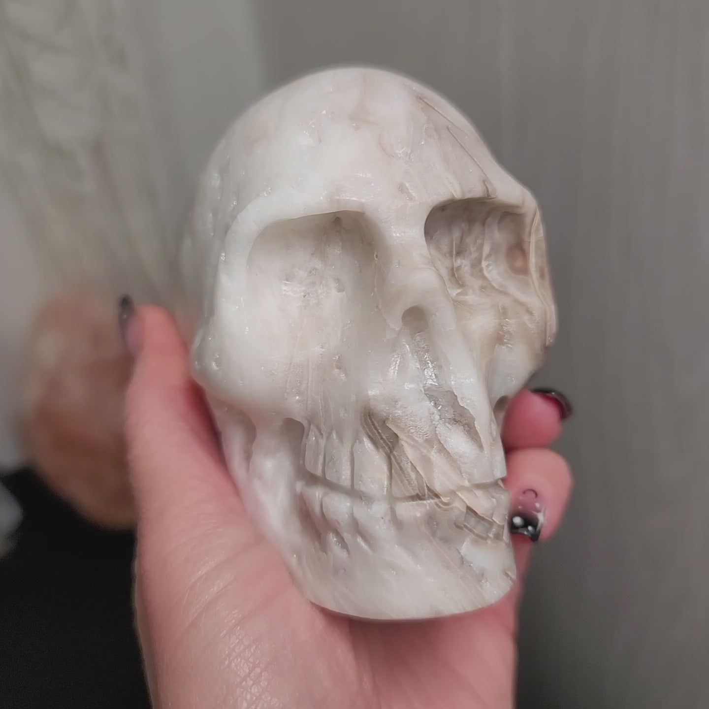 a video of a banded calcite skull hand carved from mexico